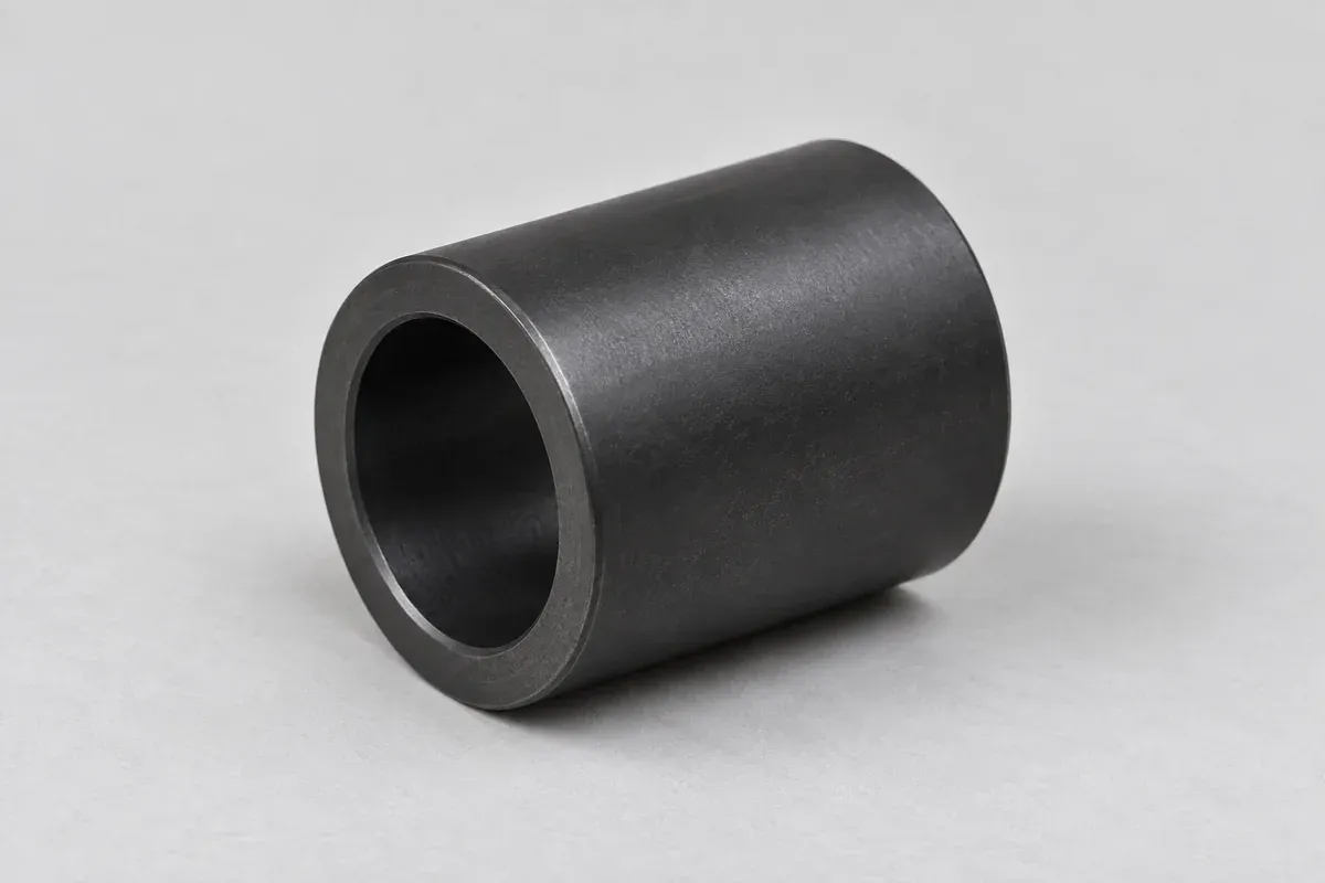 Black plastic cylindrical sleeve with a continuous bore