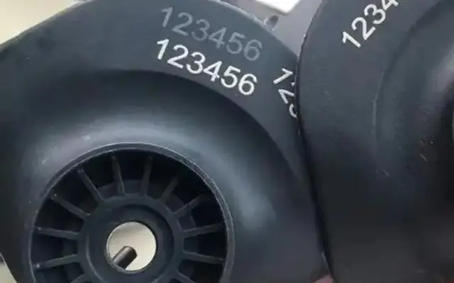 Laser-marked injection molded plastic components
