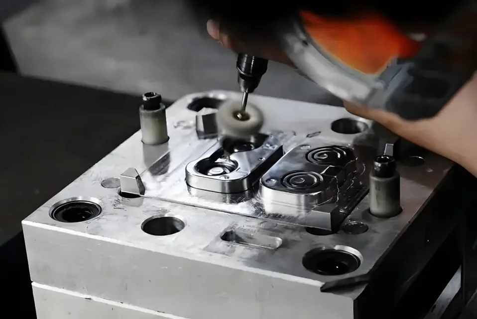 Technician polishing the cavity of an injection mold